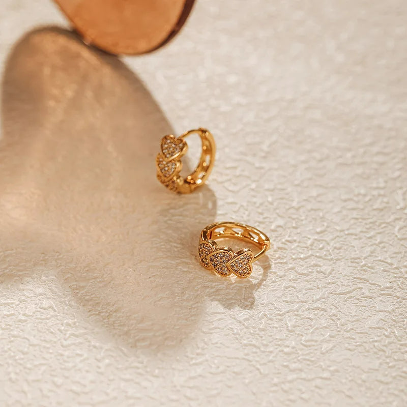 Boucle d'Oreille Enfant Créole Dorée Triple Cœur Image