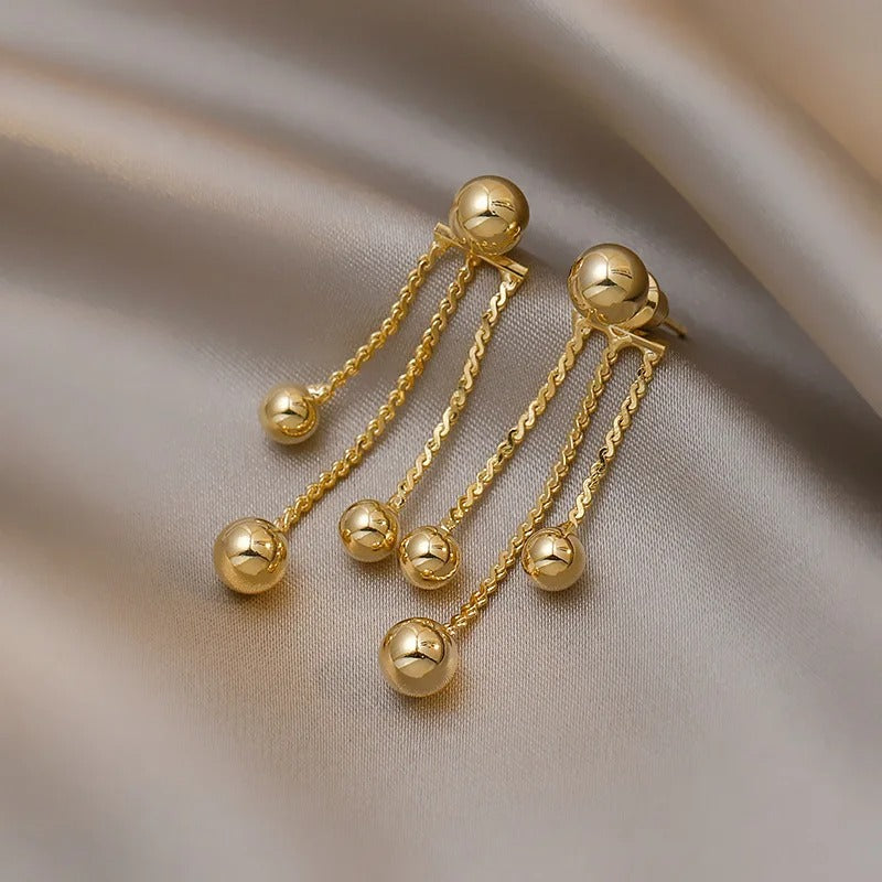 Boucle D'oreille Pendante Doré Élégante Image