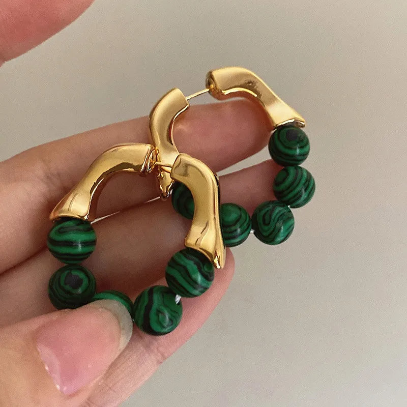 Boucle d'Oreille Verte Résistante et DurableBoucle d'Oreille Verte Résistante et Durable Image