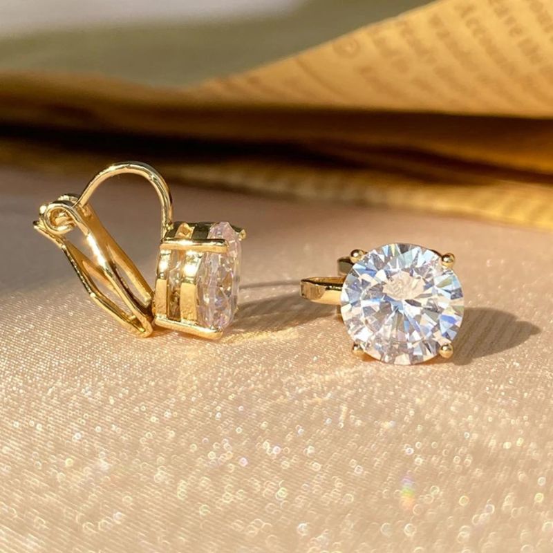 Boucles D'oreilles Clips Dorée Pierre Blanche Image